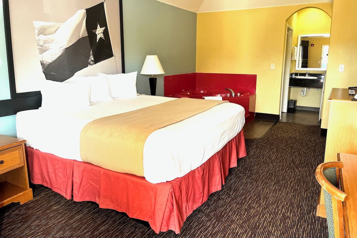 Desk, iron/ironing board, bed sheets, alarm clocks