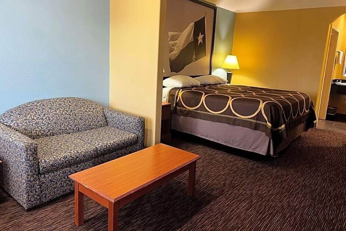 Desk, iron/ironing board, bed sheets, alarm clocks