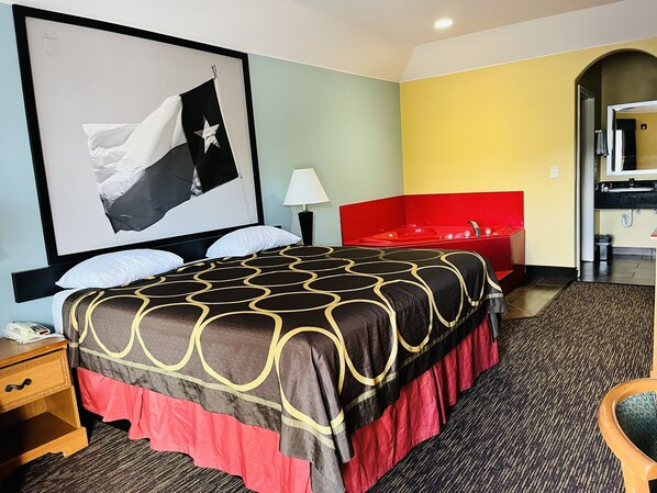 Suite, 1 King Bed, Non Smoking (Jetted Tub) | Desk, iron/ironing board, bed sheets, alarm clocks