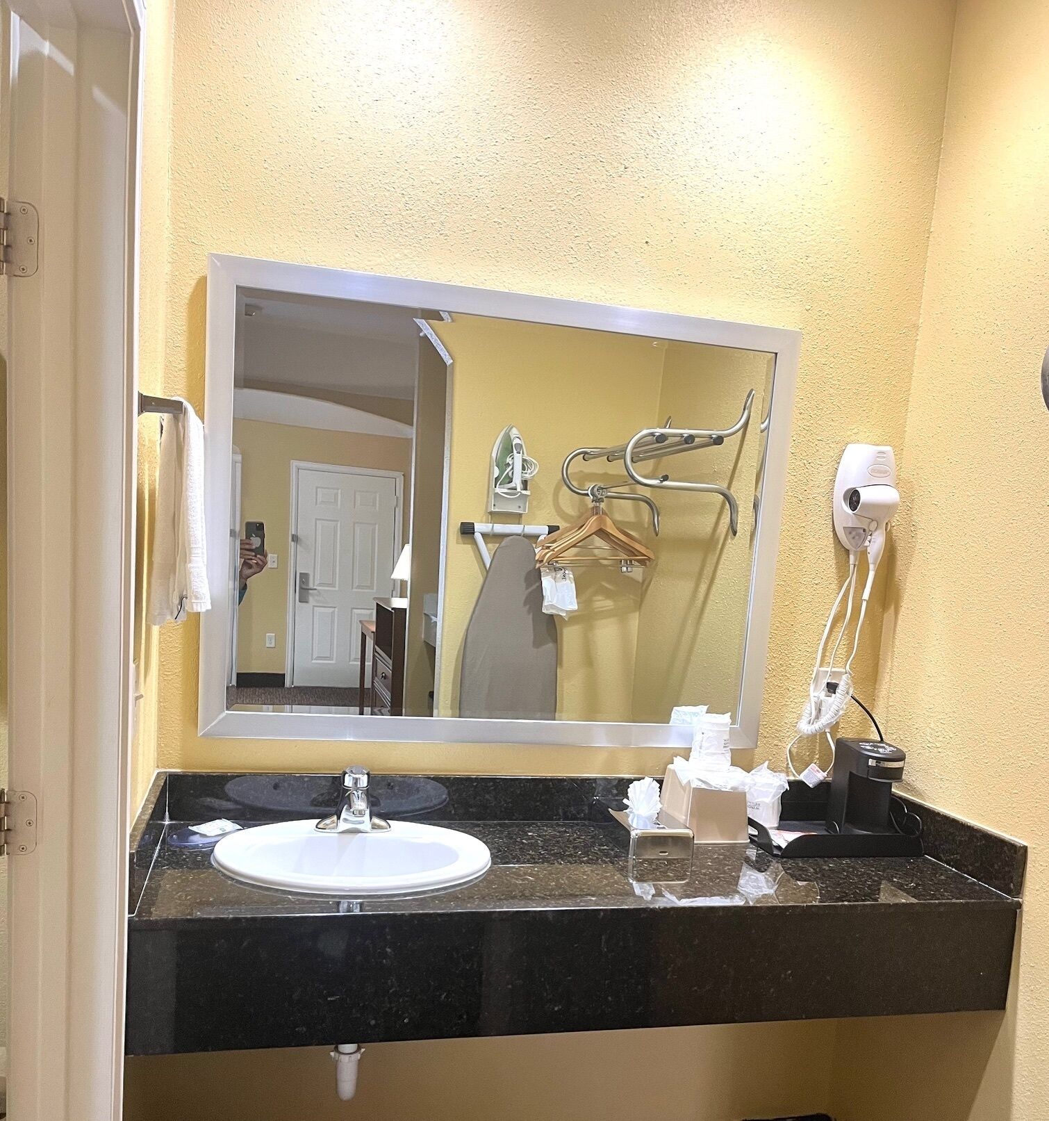 Desk, iron/ironing board, bed sheets, alarm clocks