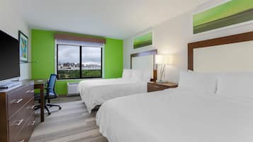 Premium bedding, desk, laptop workspace, blackout drapes