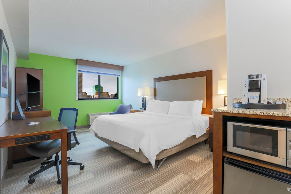 Premium bedding, desk, laptop workspace, blackout curtains