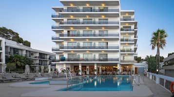 Enjoy the hotel's rooftop terrace and pool area with lounge chairs.