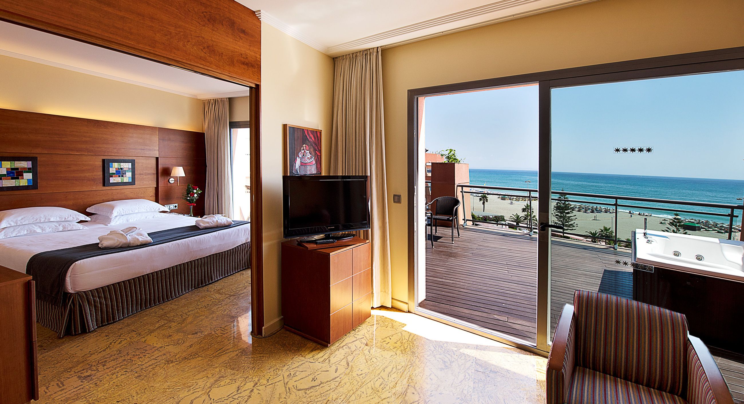 elite suite, jetted tub, sea view | 1 bedroom, minibar, in-room safe, desk