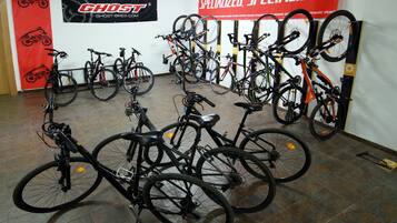 A bike shop with multiple bicycles on display and a prominent 'Specialized' banner.