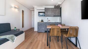 Superior Apartment, 1 Bedroom (with views) | Living area | 32-inch flat-screen TV with satellite channels