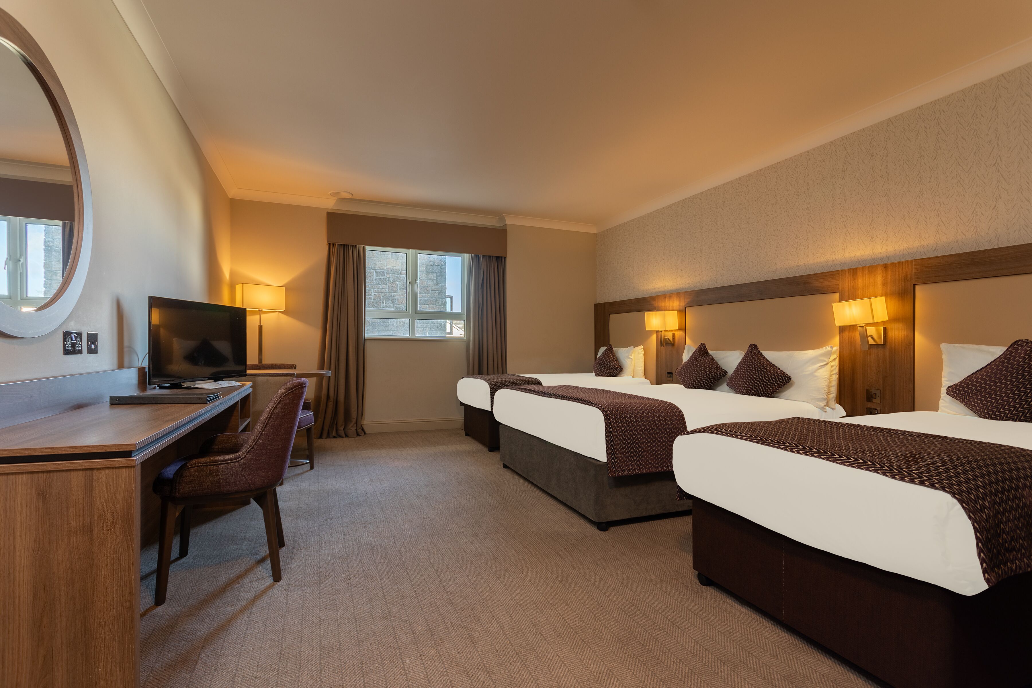 family room | 1 bedroom, desk, blackout curtains, iron/ironing board