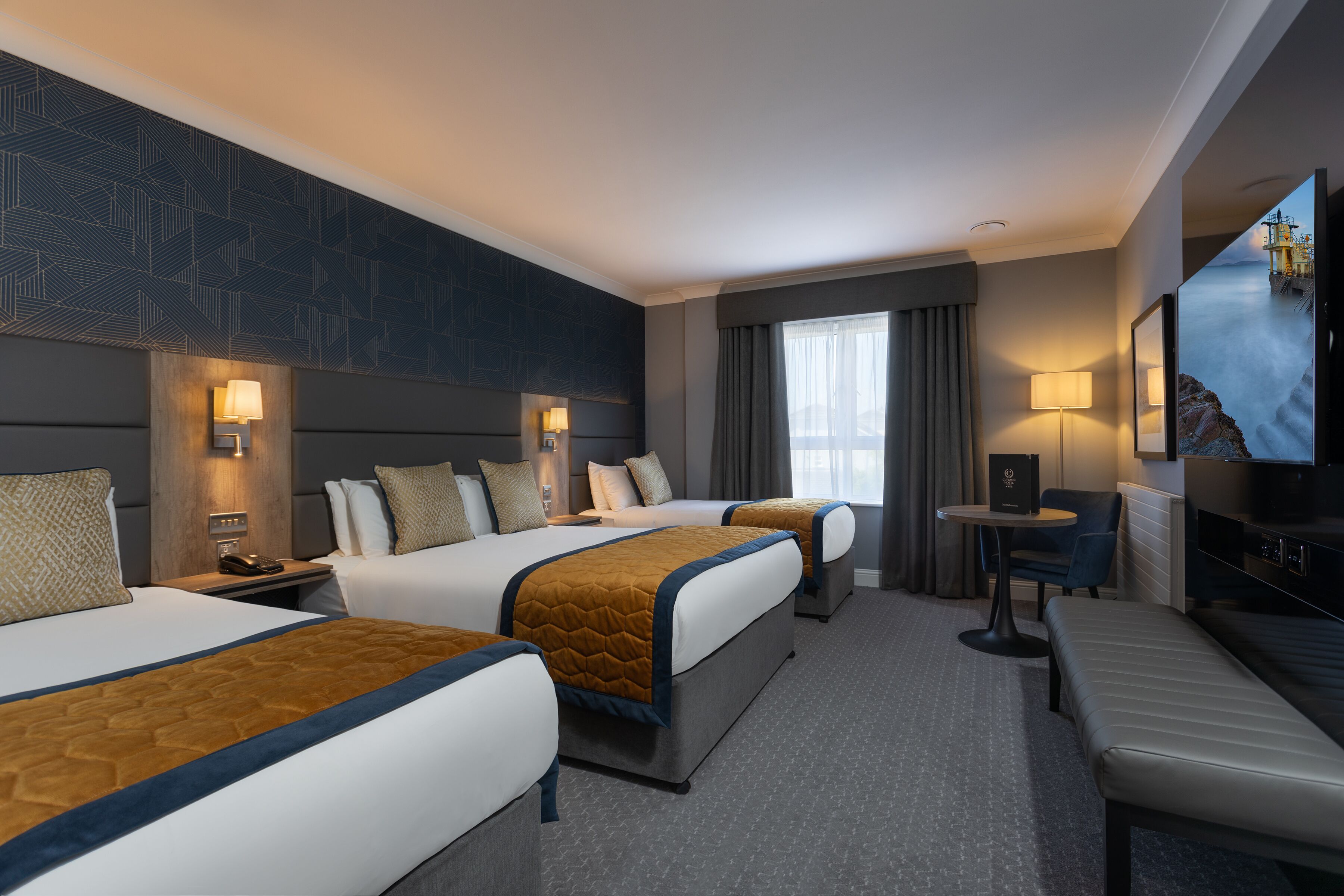 family room | 1 bedroom, desk, blackout curtains, iron/ironing board