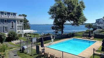 Seasonal outdoor pool, open 8:00 AM to 6:00 PM, pool umbrellas
