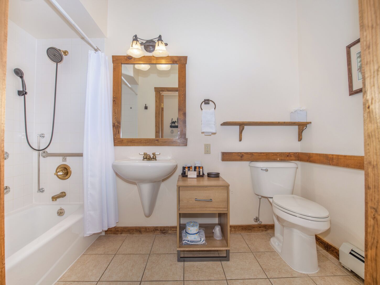 A bathroom with a bathtub, a sink, a toilet, and a shower.
