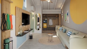 A modern living room with a flat-screen TV, wooden beams, a ceiling fan, a sofa, and a round rug.