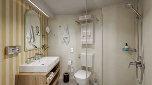 A modern bathroom with a wooden vanity, a toilet, a shower, and a mirror. - Sunny Porec Residence (Porec)