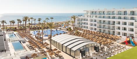 Indoor pool, outdoor pool, pool umbrellas, pool loungers