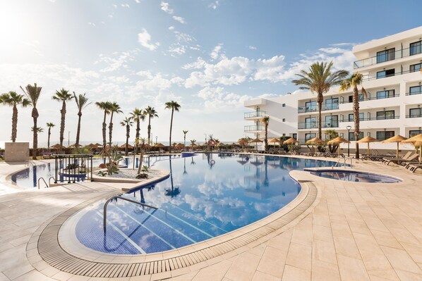 Indoor pool, outdoor pool, pool umbrellas, pool loungers