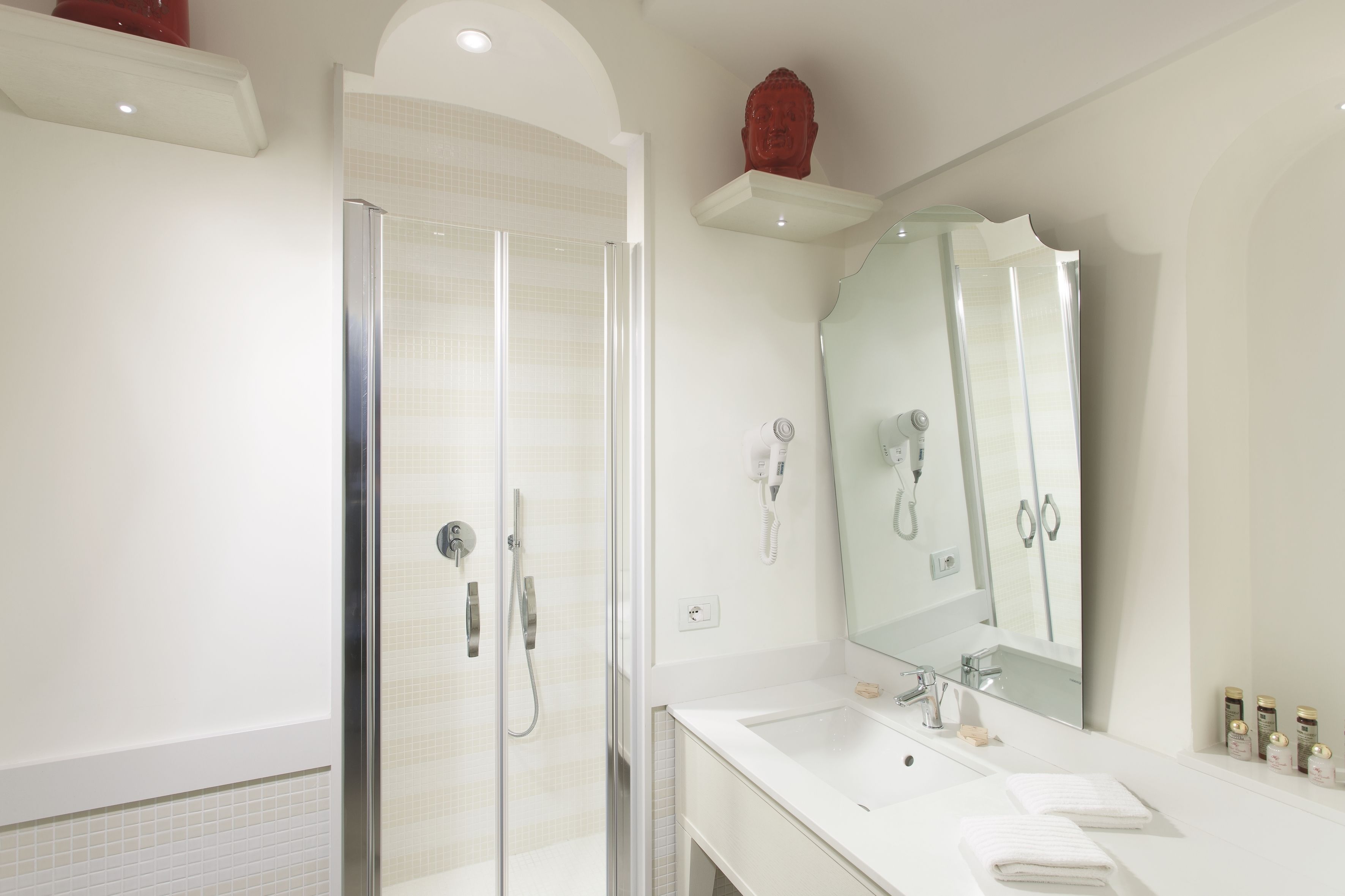 hair dryer, slippers, bidet, towels