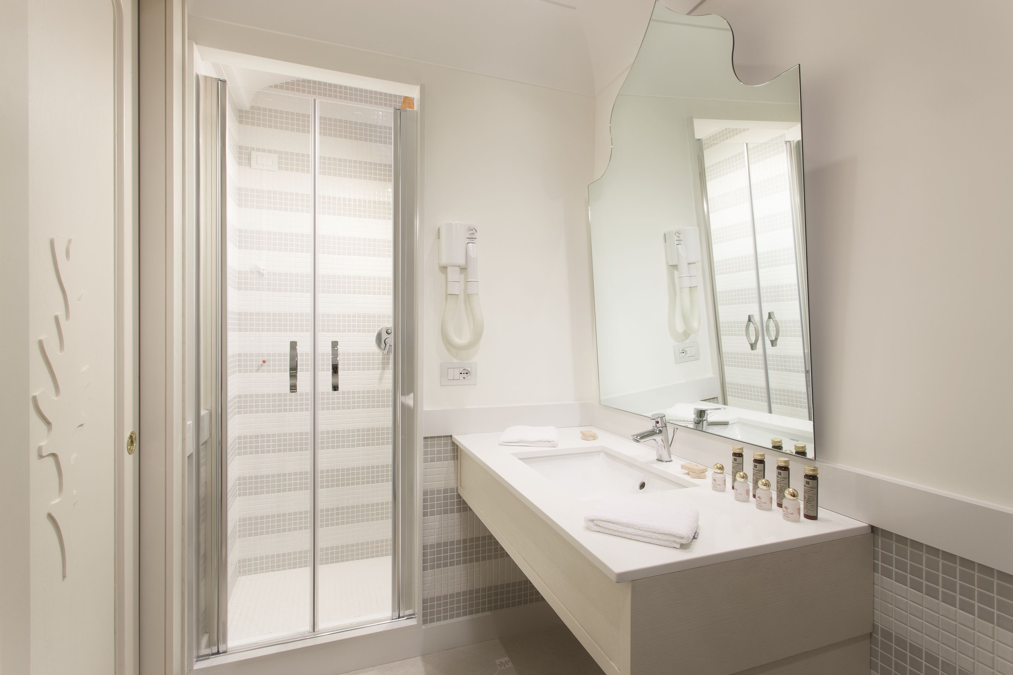 hair dryer, slippers, bidet, towels