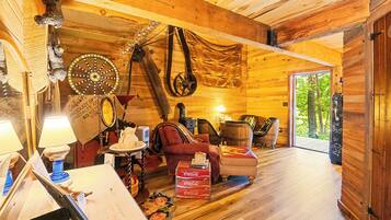 Signature Cabin (Loft At The Mill) | Living area | 26-inch flat-screen TV with cable channels, TV, toys