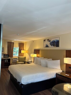 Room, 1 King Bed | Desk, blackout drapes, iron/ironing board, free WiFi