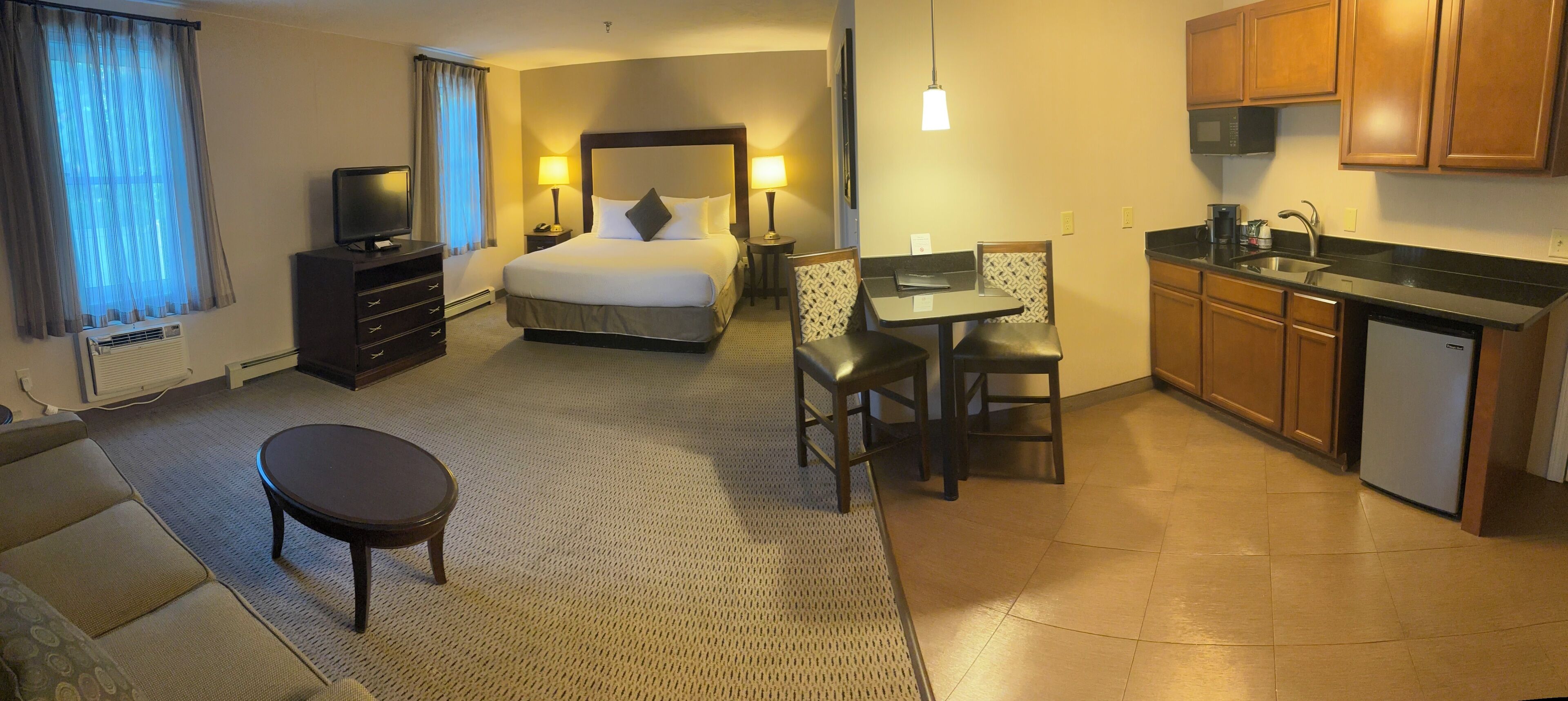 standard single room, 1 king bed with sofa bed, kitchenette | living area | 0-inch tv with cable channels