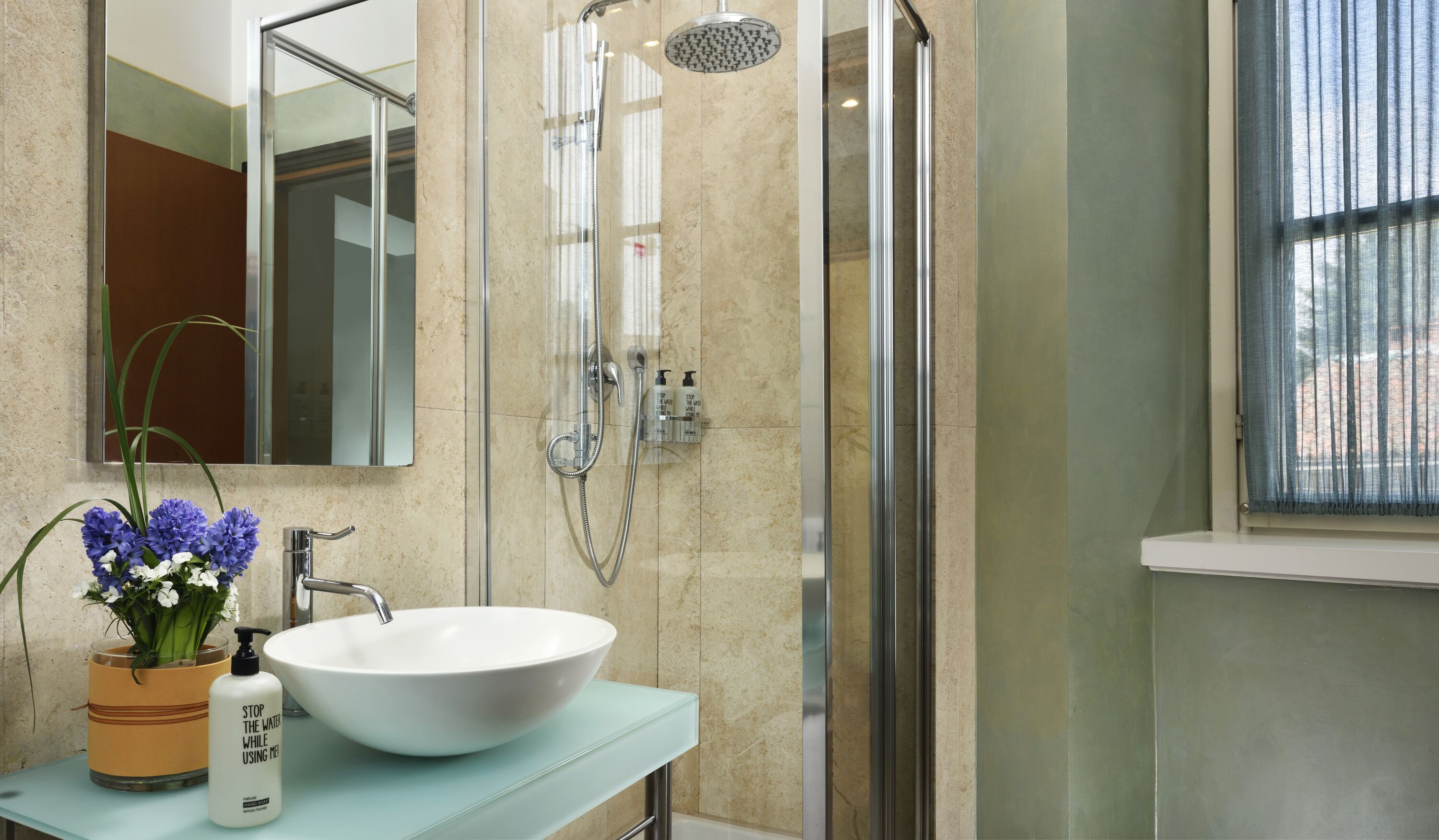 designer toiletries, hair dryer, bidet, towels