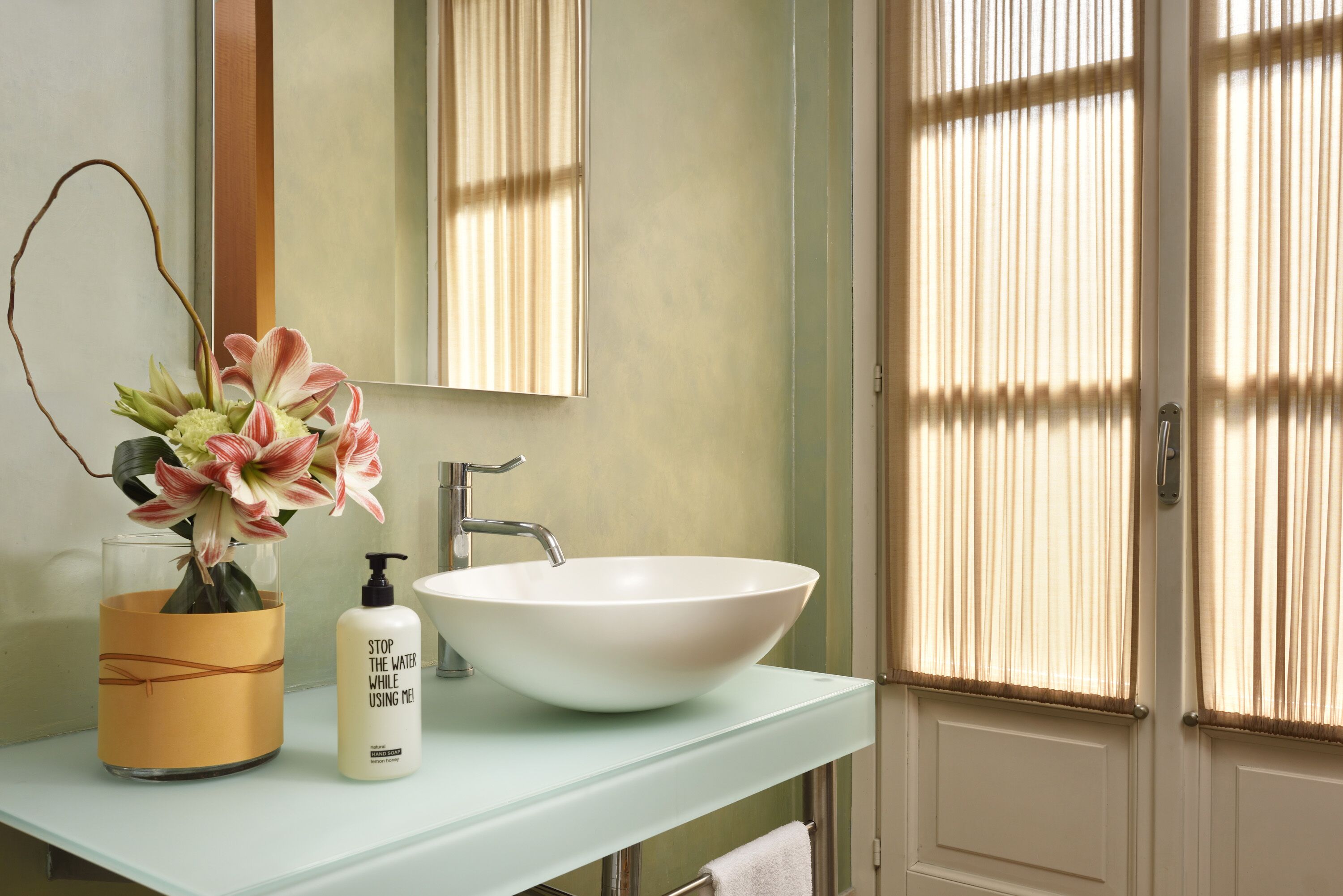 designer toiletries, hair dryer, bidet, towels