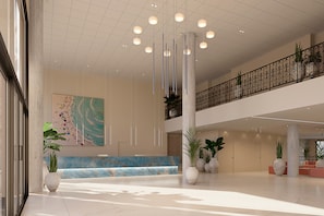 A spacious lobby with a marble reception desk, hanging lights, potted plants, and a large abstract painting on the wall.