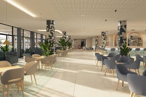 A spacious lobby with modern furniture, large windows, and decorative pillars.