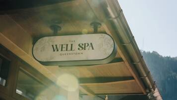 A sign for "The Well Spa" in Queenstown.