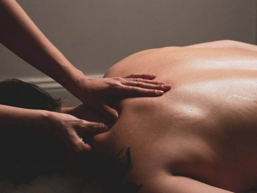 A person receiving a back massage.