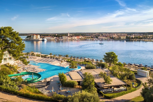 Indoor pool, outdoor pool, pool umbrellas, sun loungers