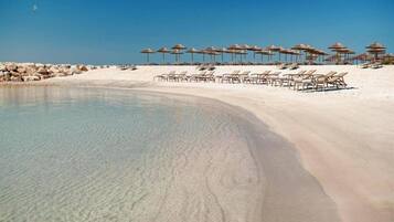On the beach, free beach cabanas, sun loungers, beach volleyball