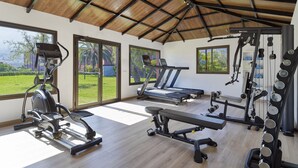 A spacious gym with cardio equipment, weight machines, and a treadmill. - Hotel Las Aguilas Tenerife, Affiliated by Melia (Puerto de la Cruz)