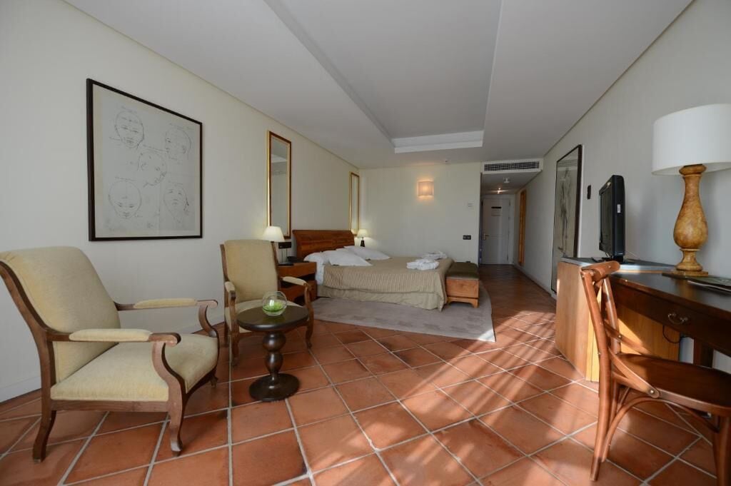 family room, city view | 1 bedroom, in-room safe, desk, laptop workspace