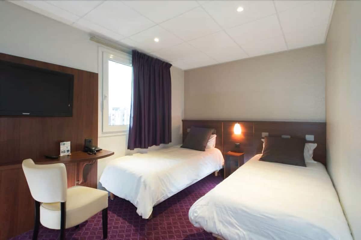 Family Room | Premium bedding, desk, blackout drapes, soundproofing