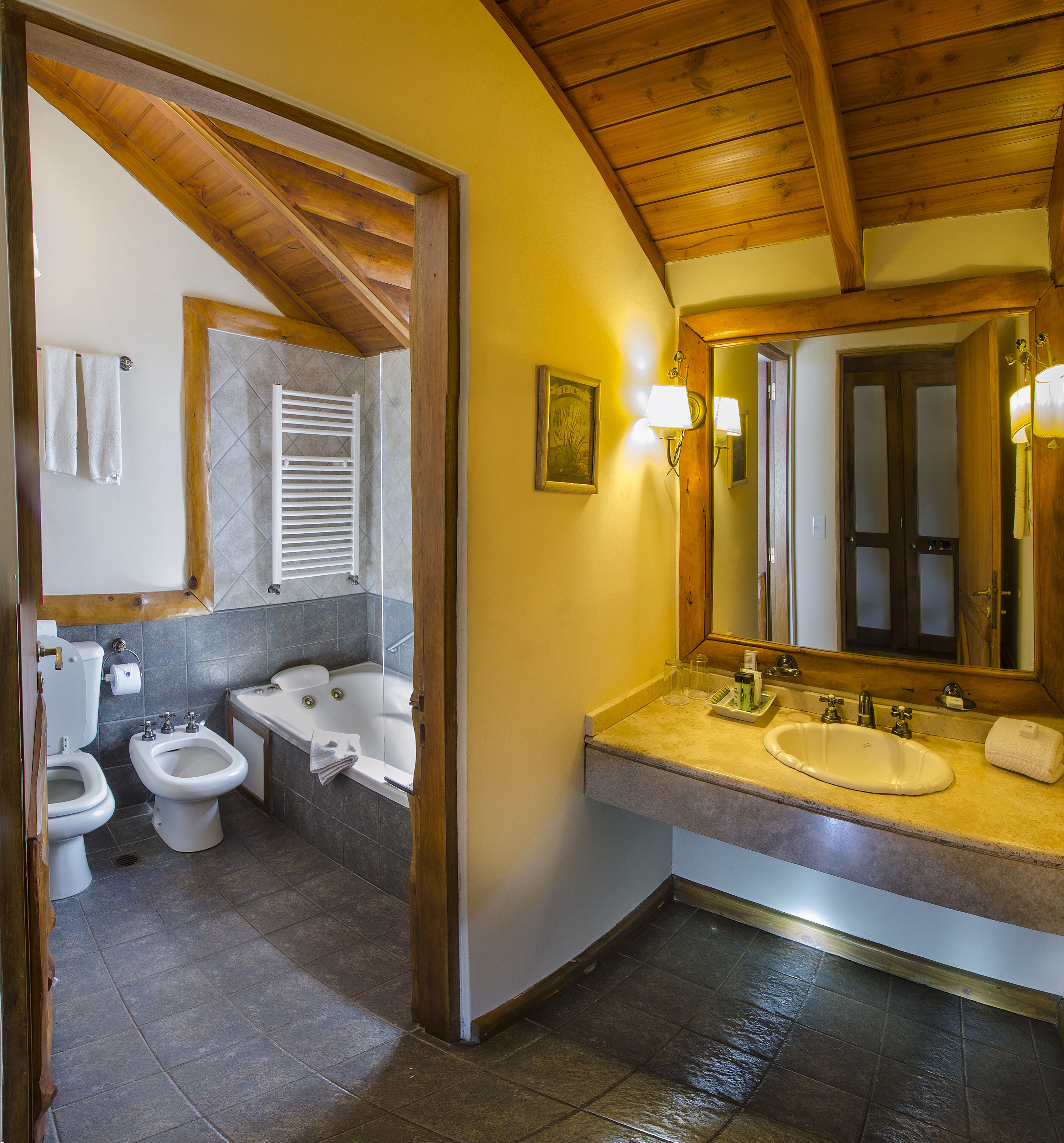 A bathroom with a bathtub, a sink, and a toilet.