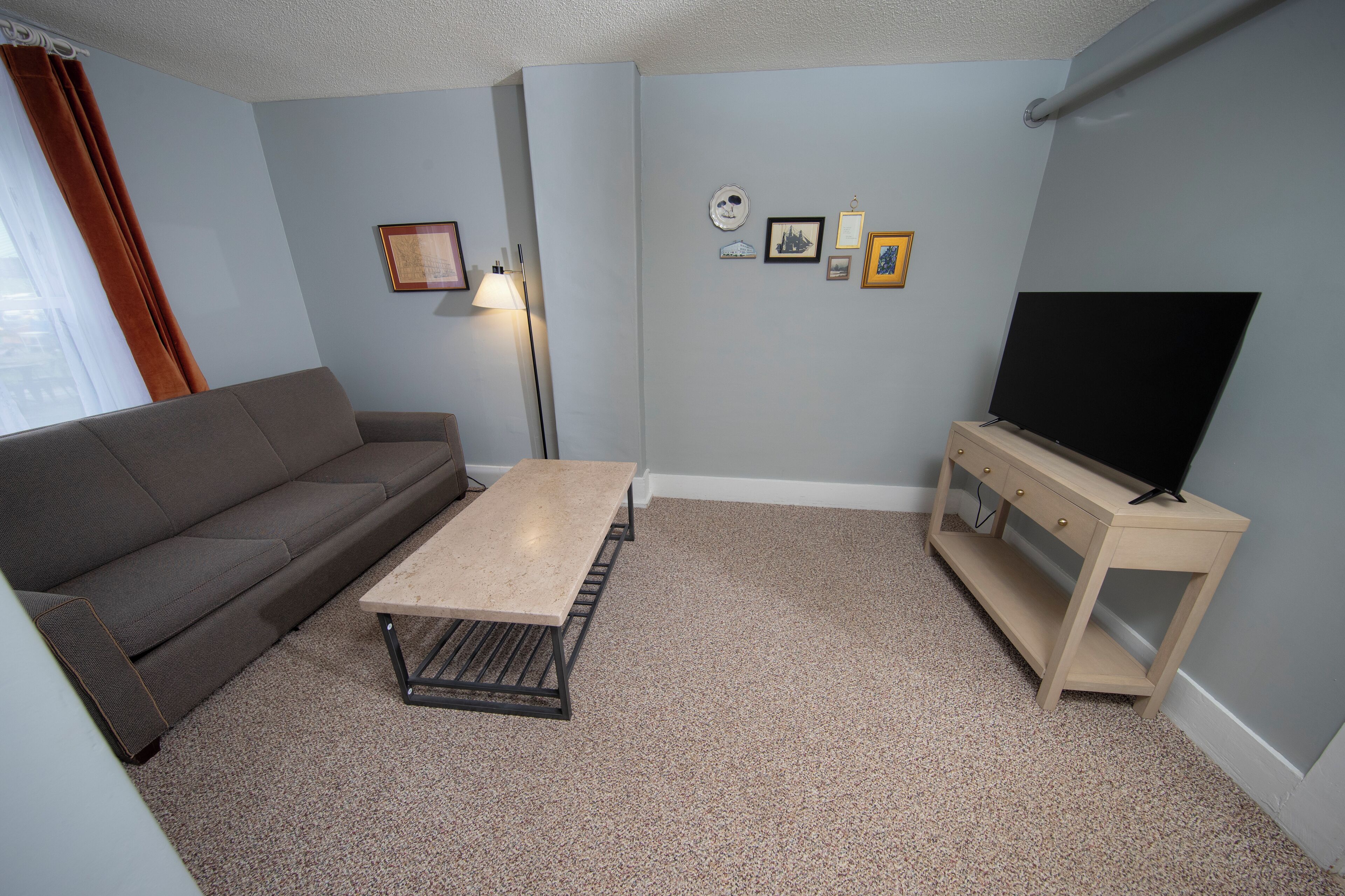 deluxe room, 1 queen bed with sofa bed, accessible, ground floor | living area | flat-screen tv