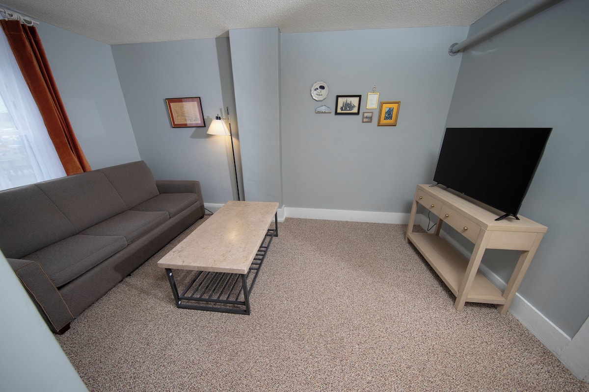 deluxe room, 1 queen bed with sofa bed, accessible, ground floor | living area | flat-screen tv