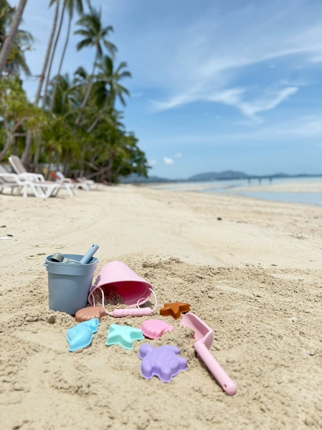 On the beach, sun-loungers, beach umbrellas, beach towels