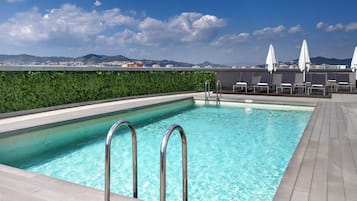 Seasonal outdoor pool, pool umbrellas, pool loungers