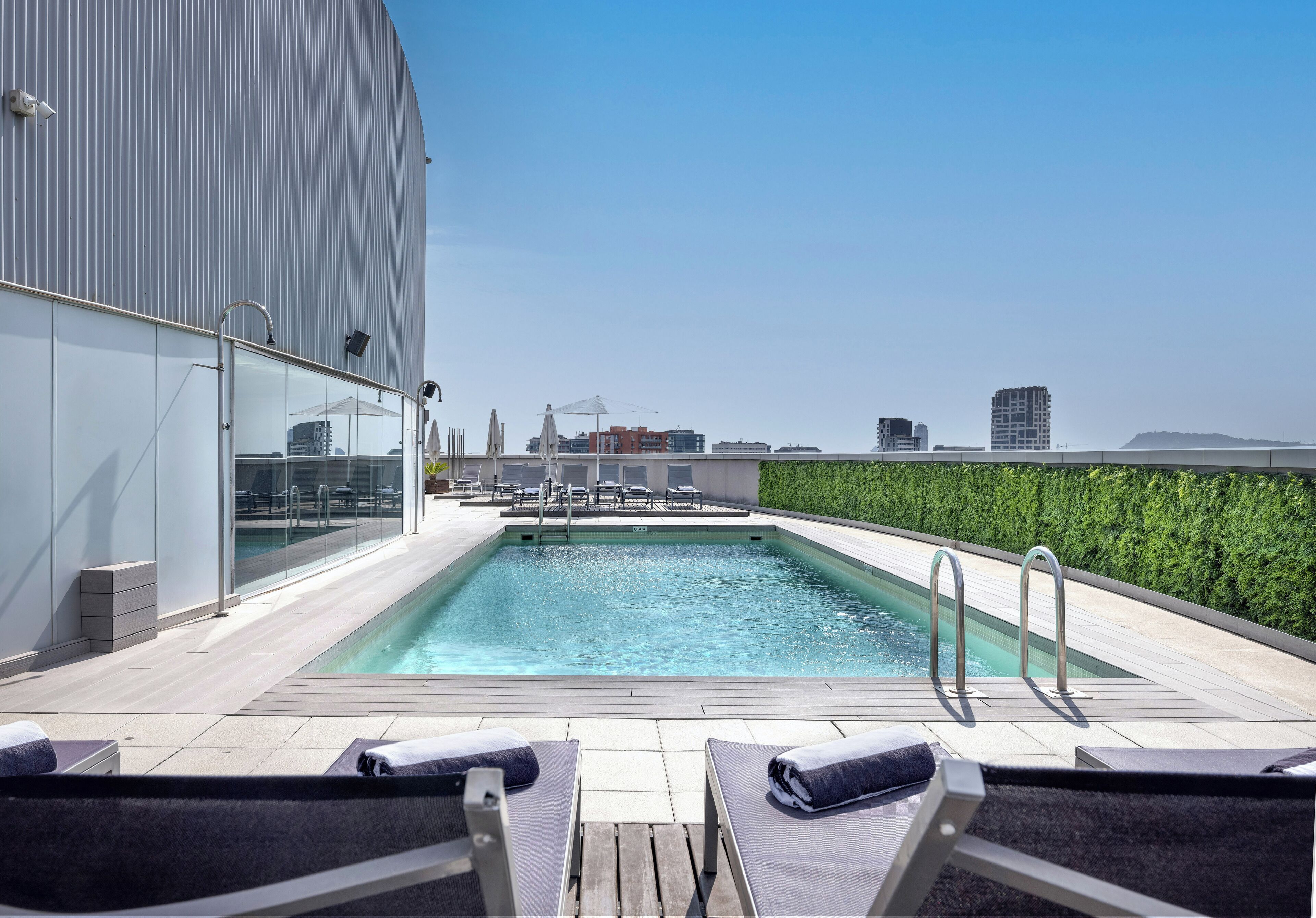 seasonal outdoor pool, pool umbrellas, pool loungers