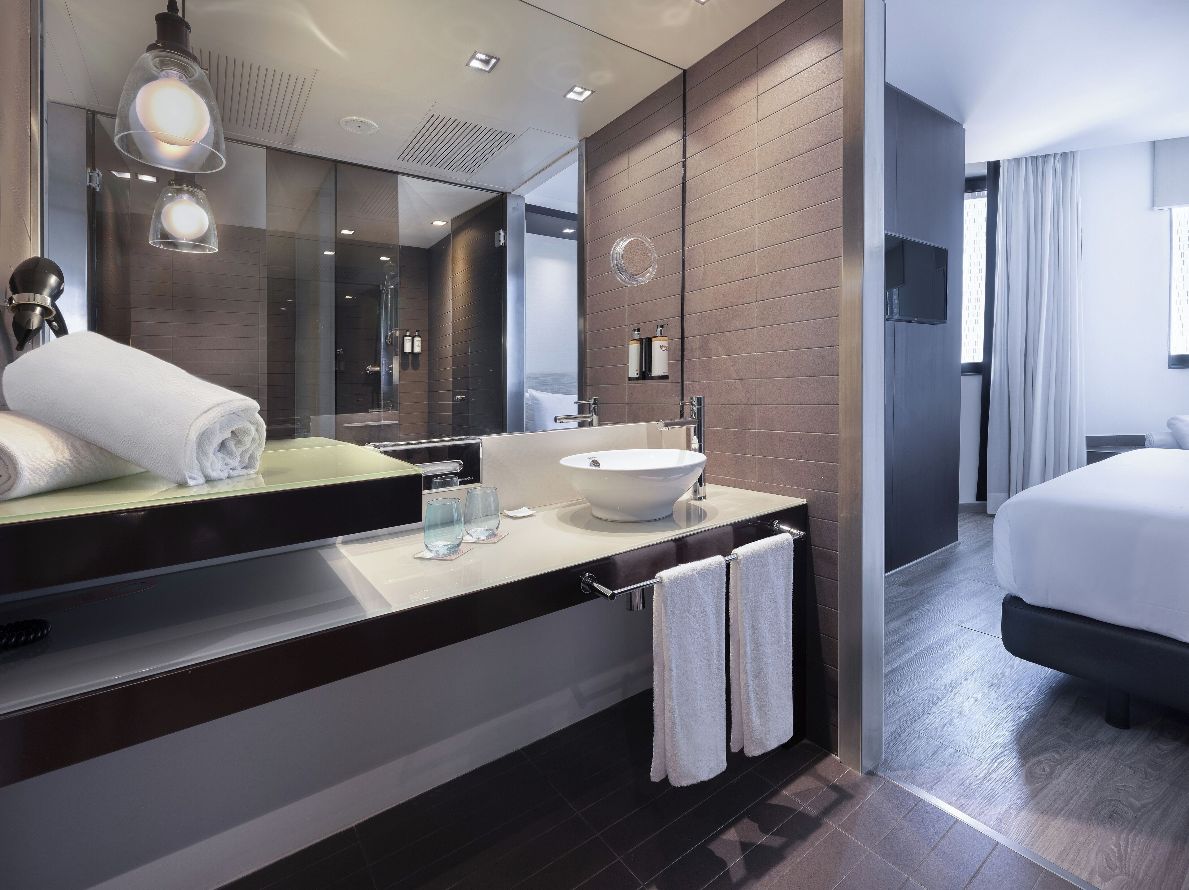 junior suite | bathroom | eco-friendly toiletries, hair dryer, towels, soap