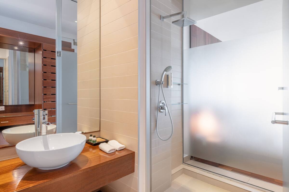 junior room, sea view | bathroom | rainfall showerhead, eco-friendly toiletries, hair dryer, bathrobes