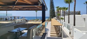 Indoor pool, outdoor pool, open 9:30 AM to 6:30 PM, pool umbrellas