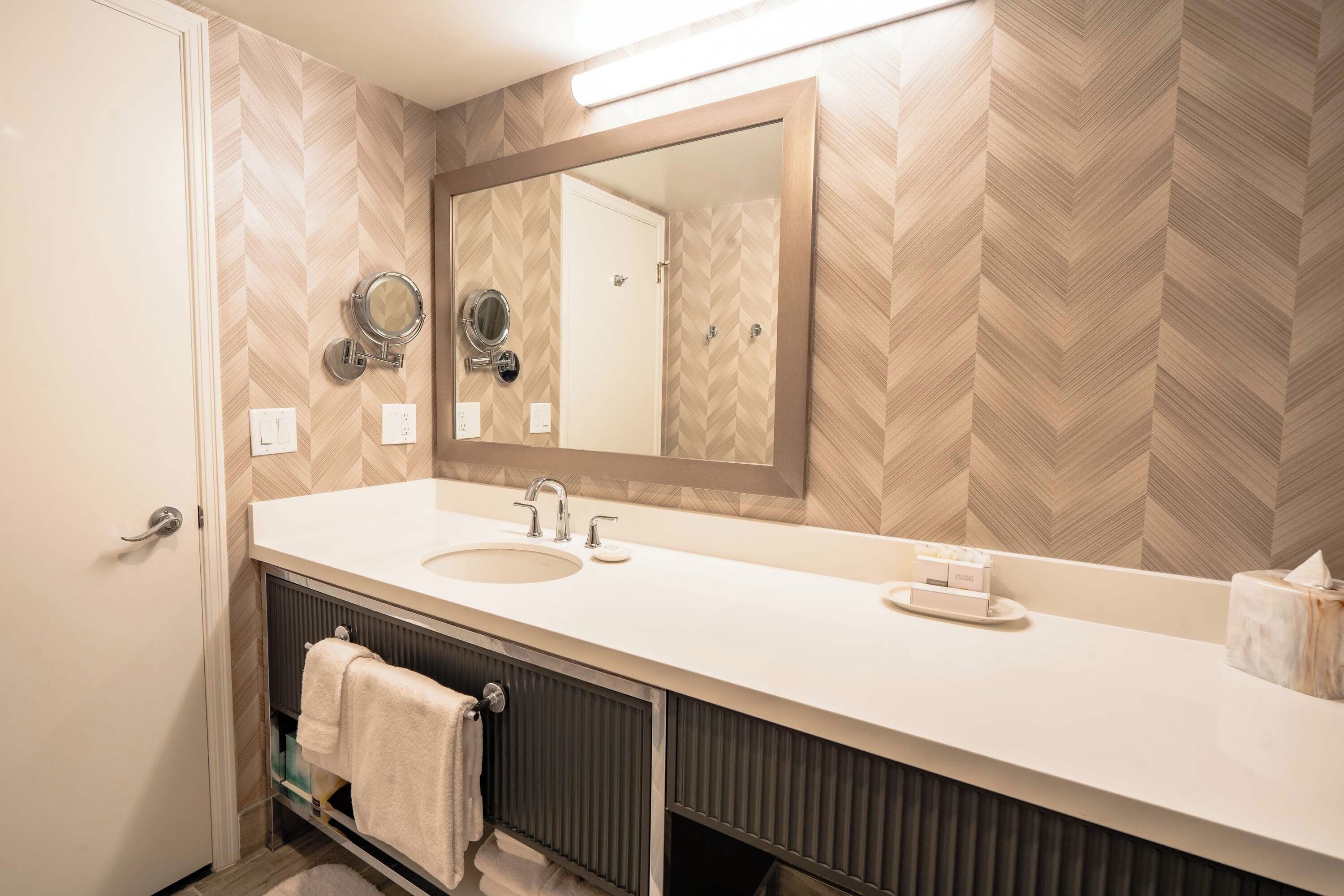 one bedroom premium suite, 1 king bed, sofa bed | bathroom | combined shower/bathtub, free toiletries, hair dryer, bathrobes