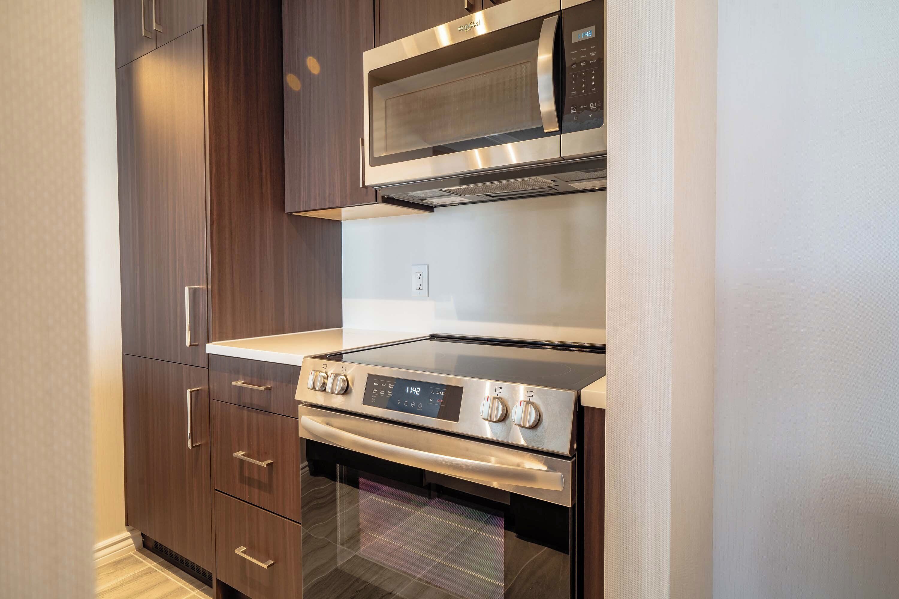 one bedroom premium suite, 1 king bed, sofa bed | private kitchen | fridge, microwave, stovetop, dishwasher