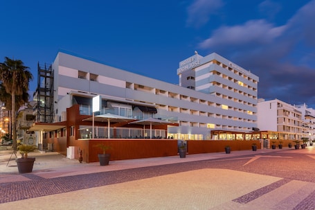 Front of property - evening/night. Dom Jose Beach Hotel