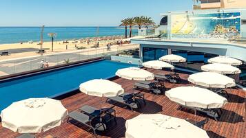 Outdoor pool, open 9:00 AM to 8:00 PM, pool umbrellas, pool loungers