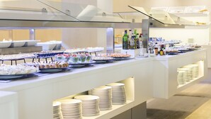 A buffet setup with various food items and beverages. - Hipotels Said (Sant Llorenc des Cardassar)