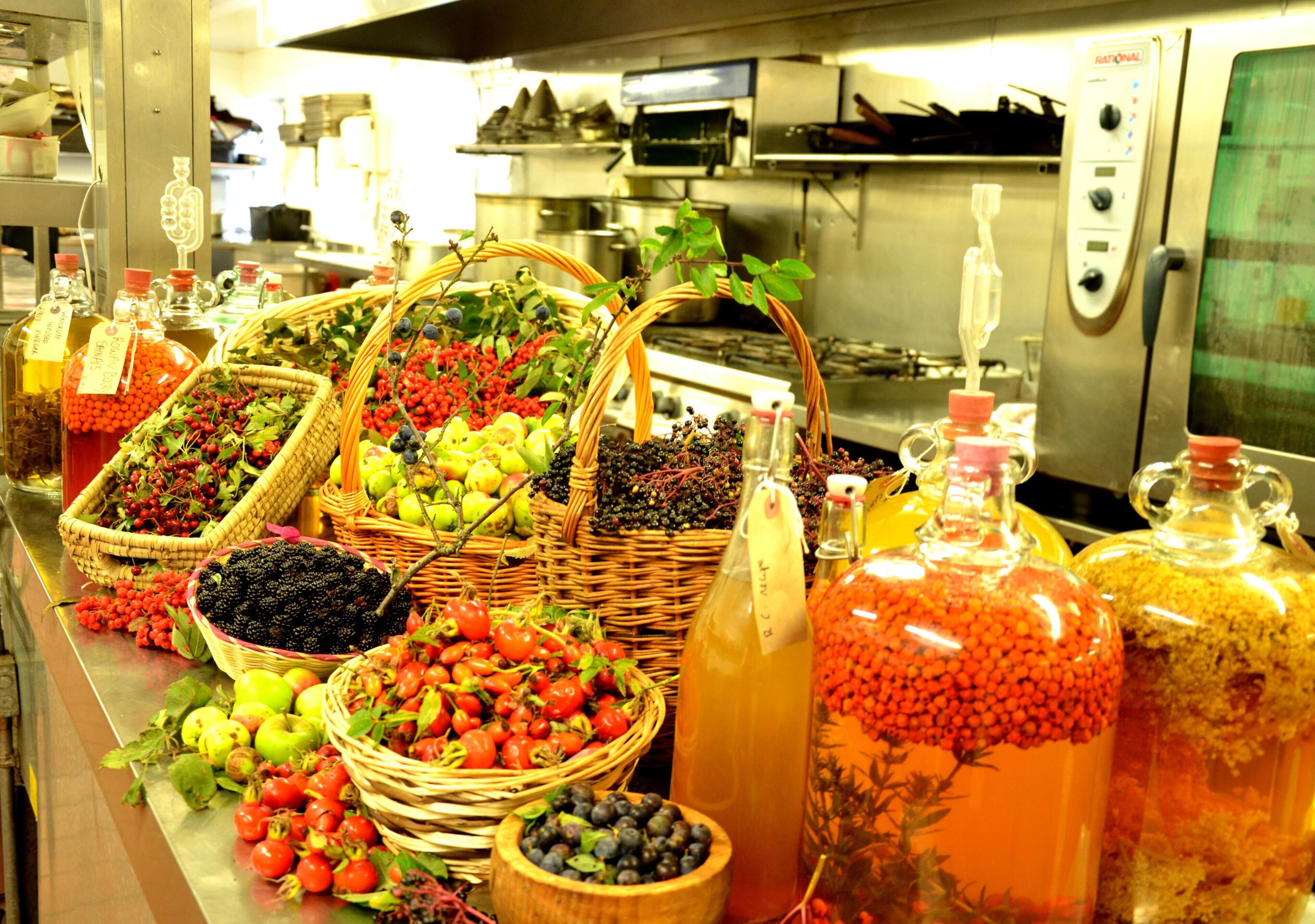 A buffet with various fruits and beverages.