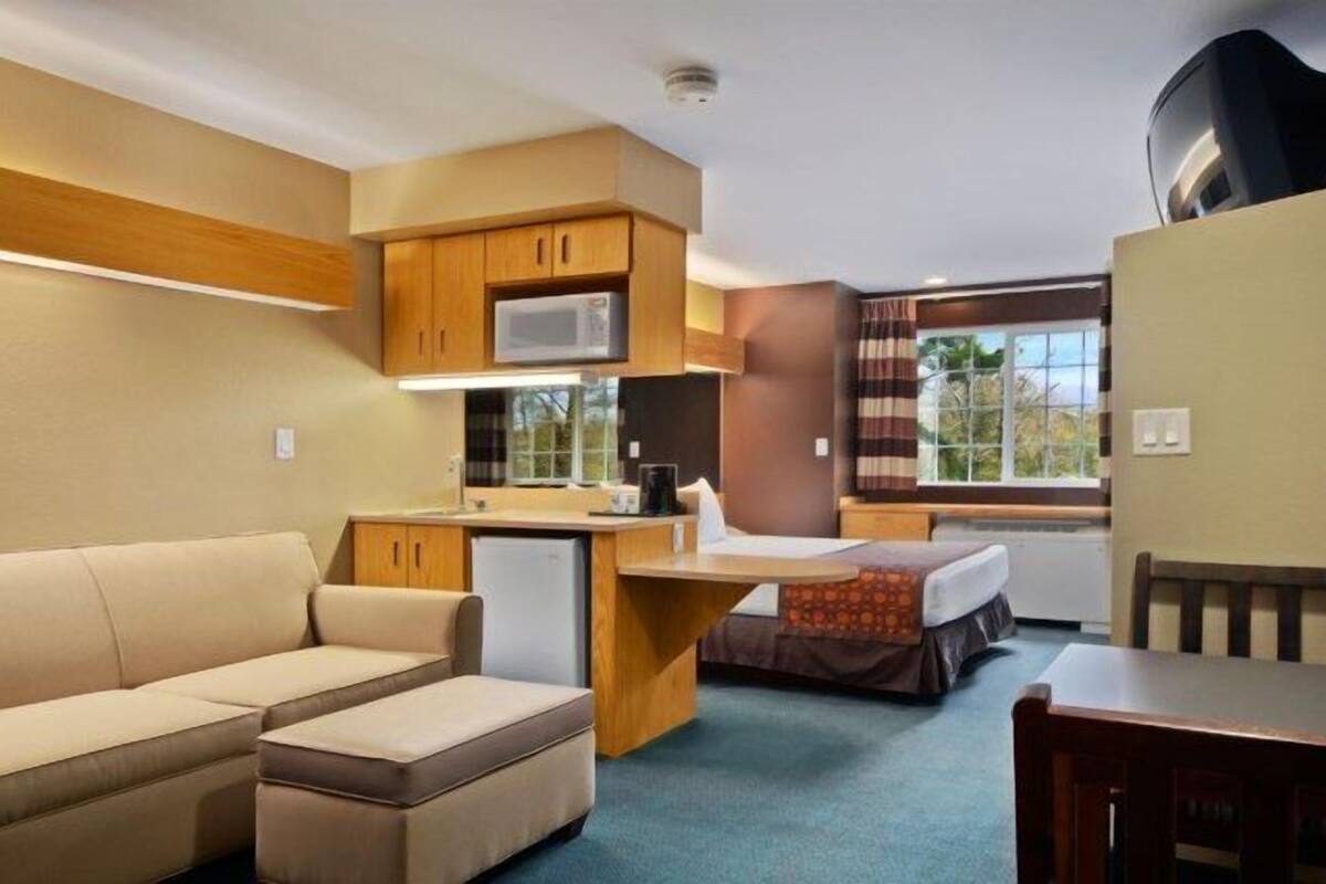 premium bedding, desk, blackout curtains, iron/ironing board